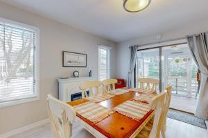 a dining room with a wooden table and chairs at Bethany Pines --- 428 Bethany Pines in Bethany Beach