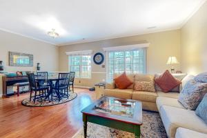 a living room with a couch and a table at The Tides --- 19979 Sandy Bottom Circle, Unit #504 in Rehoboth Beach