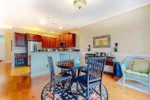 a kitchen with a table and chairs in a room at The Tides --- 19979 Sandy Bottom Circle, Unit #504 in Rehoboth Beach