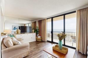 a living room with a couch and a television at Sea Colony --- 508 Brandywine house in Bethany Beach