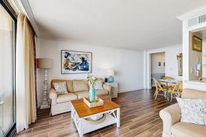 a living room with a couch and a table at Sea Colony --- 508 Brandywine house in Bethany Beach