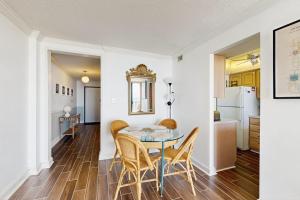 a kitchen and dining room with a table and chairs at Sea Colony --- 508 Brandywine house in Bethany Beach