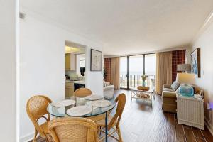 a living room with a glass table and chairs at Sea Colony --- 508 Brandywine house in Bethany Beach