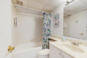 a bathroom with a sink and a toilet and a mirror at Sea Colony --- 508 Brandywine house in Bethany Beach +38 photos