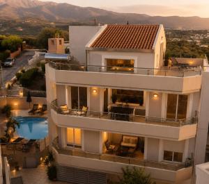 a large white building with a swimming pool at Endless View Villa with Private Pool & BBQ in Daratso