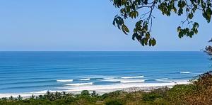 a view of a beach with the ocean at Vista Naranja Retreat in Santa Teresa Beach