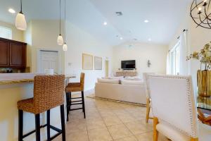 a kitchen and living room with a table and a couch at Villa Katrin in Naples