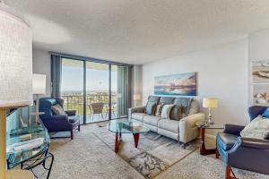 a living room with a couch and a table at Seaview Sunsets in Marco Island