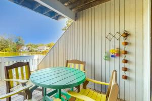 a patio with a table and chairs on a porch at Sea Colony - 1004D Brighton Vw in Bethany Beach