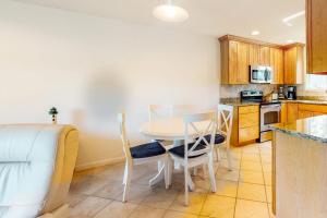 a kitchen with a table and chairs in a room at Sea Colony - 1004D Brighton Vw in Bethany Beach