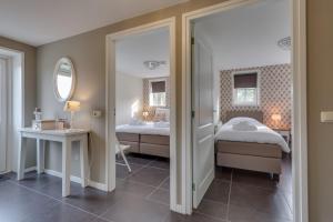 Postel nebo postele na pokoji v ubytování B&B vakantieappartementen Dalerheugte
