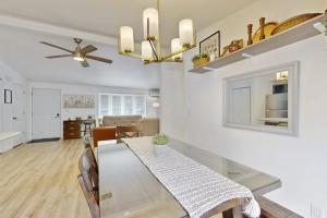 a dining room and living room with a dining table at Whispering Pines in Wisconsin Dells