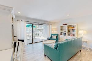 a living room with a couch and a table at Sea Colony --- 3404 Round Robin Way in Bethany Beach