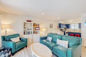 a living room with a blue couch and two chairs at Sea Colony --- 3404 Round Robin Way in Bethany Beach