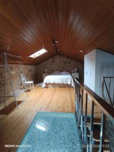 a bedroom with a bed and a wooden ceiling at "la Casita" in Boiro