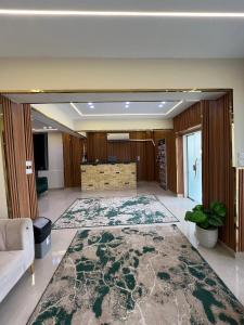 a living room with a large rug on the floor at Crown pyramids hotel in Cairo