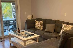 a living room with a couch and a coffee table at Franzone Fun in Saint James City