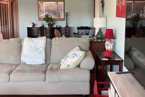a living room with a couch and a table at Franzone Fun in Saint James City