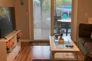 a living room with a couch and a coffee table at Franzone Fun in Saint James City