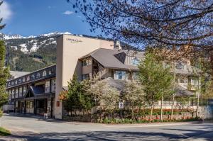 a hotel in the mountains with a building at Listel Whistler, a Coast Hotel in Whistler