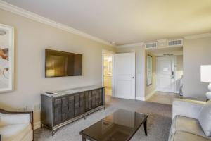 a living room with a couch and a table at Marco Beach Ocean Resort Condominiums #605 in Marco Island
