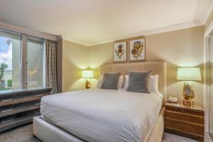 a bedroom with a large bed and a window at Marco Beach Ocean Resort Condominiums #605 in Marco Island +37 photos