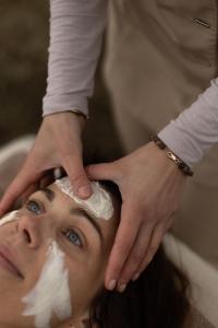 a woman getting her hair washed at a hair salon at Cozmoss Boutique Hotel in Erica