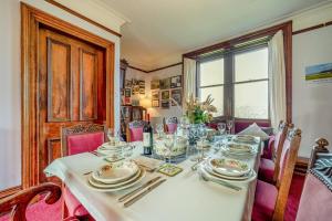 a dining room table with plates and silverware on it at 5 Bed in Shiskine oc-b33664 in Shiskine +12 photos