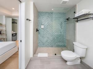 a bathroom with a toilet and a shower at Casa Collins in Miami Beach +60 photos