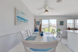 a dining room with a table with a surfboard on it at Southwest Florida Sanctuary in Cape Coral