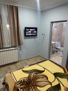 a room with a large octopus rug on the floor at Imperio Boge Hotel in Bogë