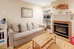 a living room with a couch and a fireplace at Beaconhill Road 68 in Ocean Pines
