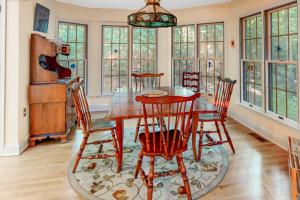 a dining room with a wooden table and chairs at Beaconhill Road 68 in Ocean Pines