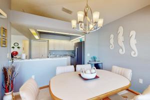 a kitchen and dining room with a white table and chairs at Sunny Way in Rotunda-West +17 photos