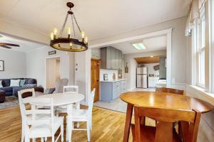 a kitchen and living room with a table and chairs at South Haven Retreat in South Haven