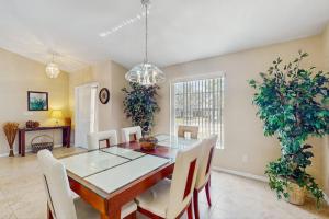 a dining room with a table and chairs at Marco Sands in Marco Island +24 photos