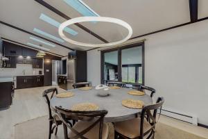 a kitchen and dining room with a table and chairs at La Casa Chikaming in Union Pier