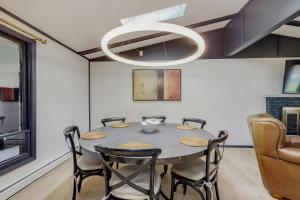 a dining room with a table and chairs at La Casa Chikaming in Union Pier