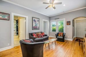 a living room with a couch and a table at Hydrangea House in New Buffalo
