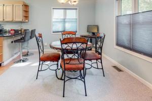 a kitchen with a table and chairs in a room at Tranquil Woods in Ocean Pines