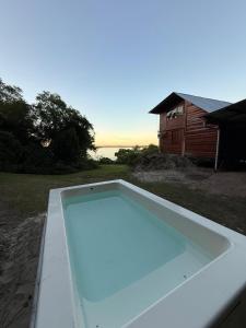 an empty swimming pool in front of a house at El Amado in General Alvear