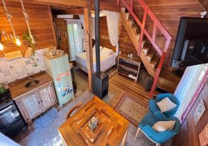 an overhead view of a room with a kitchen and a living room at Boutique Bangalôs De São Chico in São Francisco de Paula