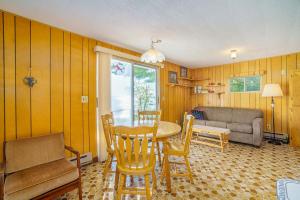 a living room with a table and chairs and a couch at Grandma's Sandbox in Beulah