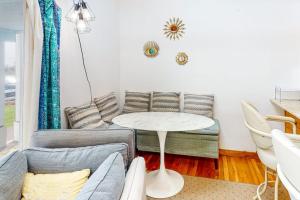 a living room with a couch and a table at Riviera Sunset in Chatham