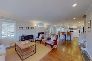 a living room with a couch and a table at Cotuit Mannor in Cotuit