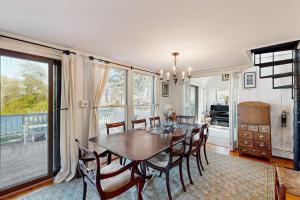 a dining room with a table and chairs at Soundmeadow House in Oak Bluffs +26 photos