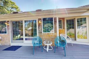 a group of chairs and a table on a porch at Seaside Park Retreat in West Hyannisport