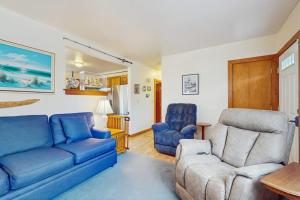 a living room with a couch and a chair at Hyannis Beach House in Hyannis