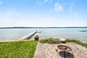 a dock on the water with a table and chairs at Cherry Fish North in Beulah