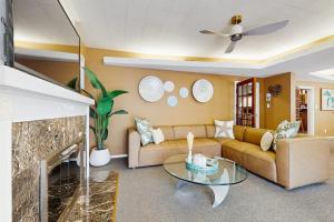 a living room with a couch and a fireplace at The Townline House in Union Pier